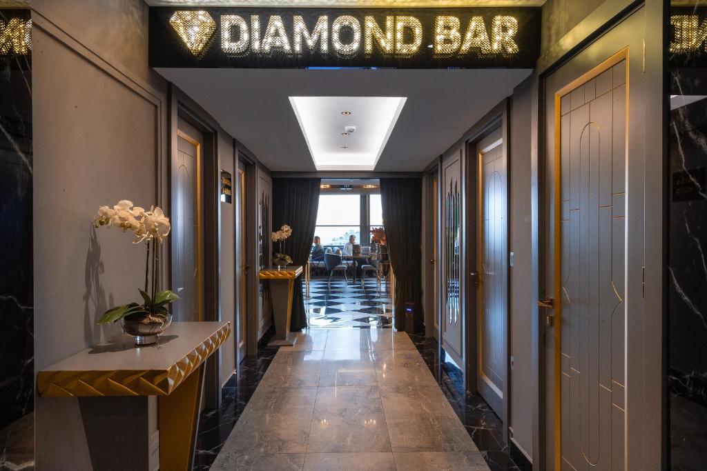 Grand Washington Hotel - a hallway with a diamond bar sign on the wall at Grand Washington Hotel in Istanbul