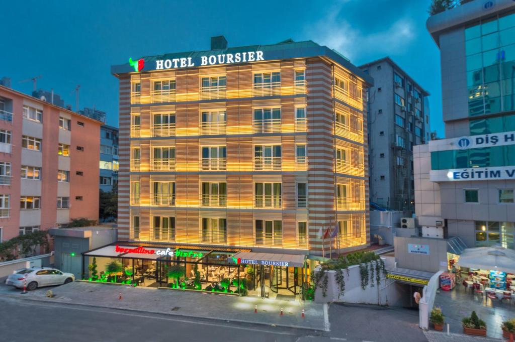 Hotel Boursier 1 & Spa - a hotel building with a sign on top of it at Hotel Boursier 1 &amp; Spa in Istanbul