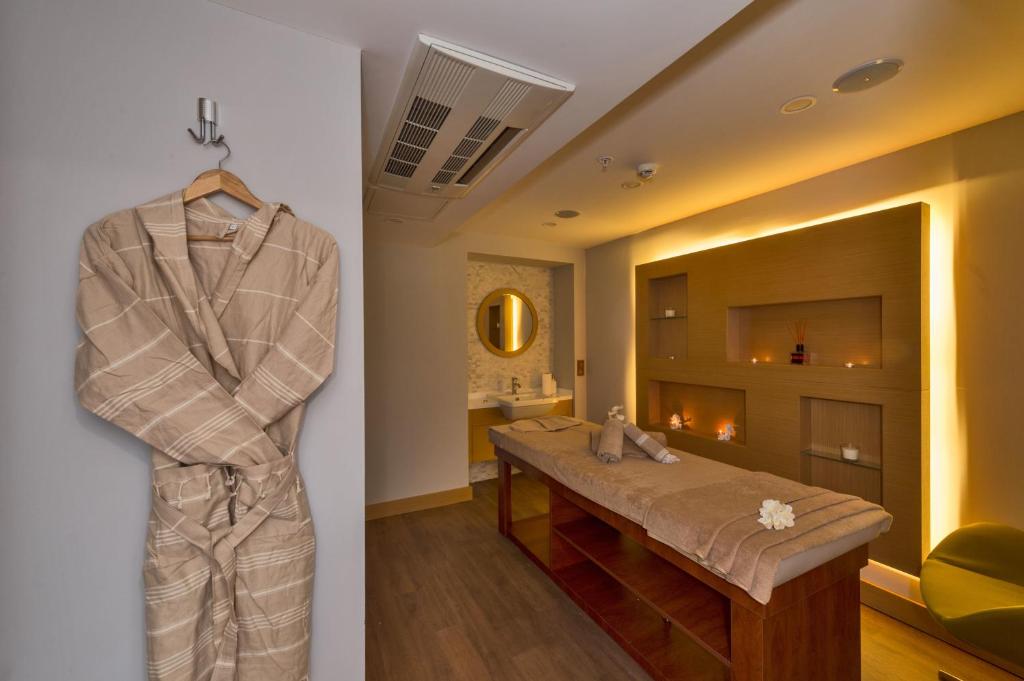 Hotel Boursier 1 & Spa - a robe hanging on a wall in a room at Hotel Boursier 1 &amp; Spa in Istanbul