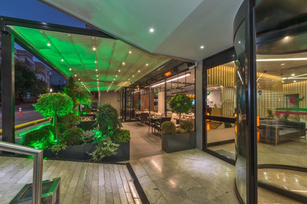 Hotel Boursier 1 & Spa - a lobby with plants in pots in a building at Hotel Boursier 1 &amp; Spa in Istanbul