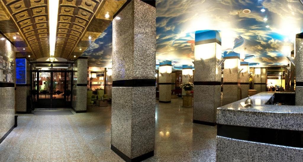 Hotel Buyuk Keban - a lobby of a building with a ceiling with clouds at Hotel Buyuk Keban in Istanbul