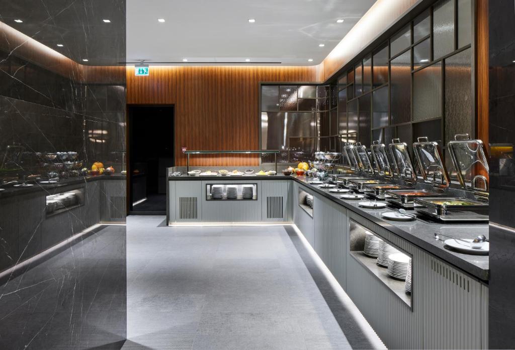 Lamartine Hotel - a kitchen with a counter with dishes on it at Lamartine Hotel in Istanbul