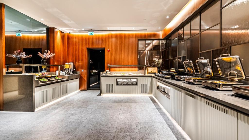 Lamartine Hotel - a large kitchen with counters and a counter top at Lamartine Hotel in Istanbul