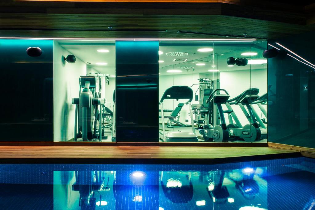 Lasagrada Hotel Istanbul - a gym with a glass window with tread machines at Lasagrada Hotel Istanbul in Istanbul