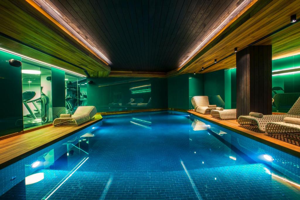 Lasagrada Hotel Istanbul - a swimming pool with chairs in a building at Lasagrada Hotel Istanbul in Istanbul