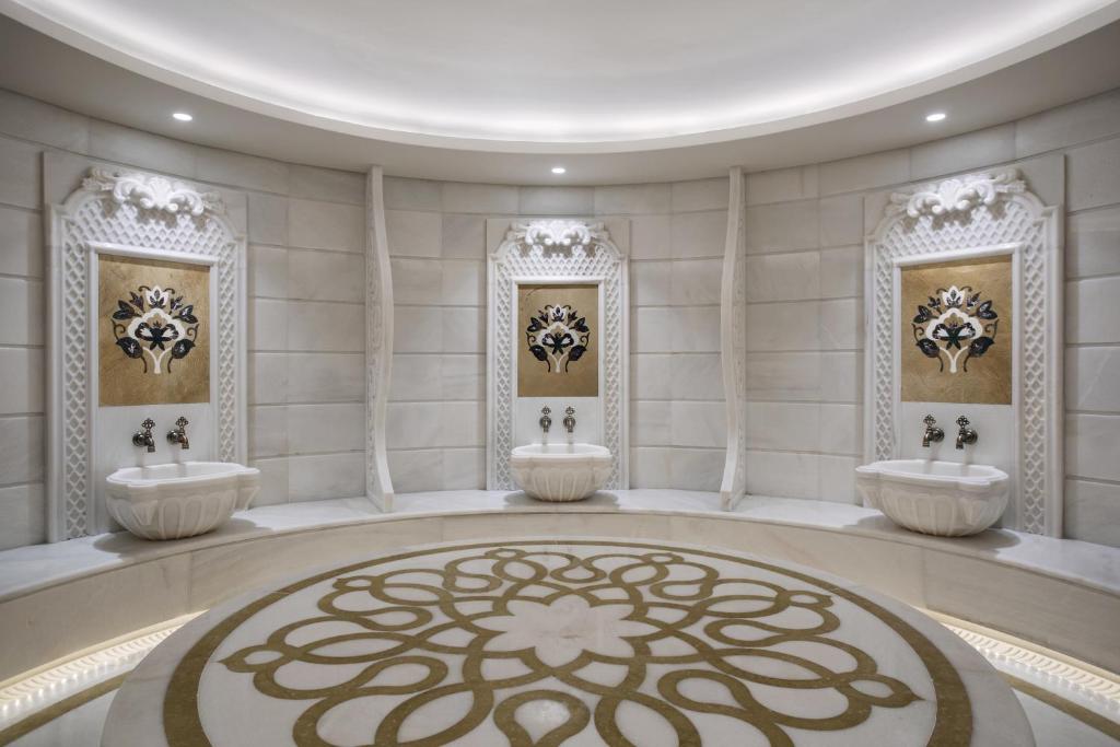Lazzoni Hotel - a bathroom with two sinks in a room at Lazzoni Hotel in Istanbul