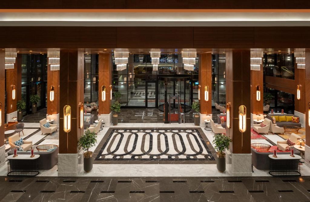 Mövenpick Hotel Istanbul Asia Airport - an overhead view of the lobby of a hotel at Mövenpick Hotel Istanbul Asia Airport in Istanbul