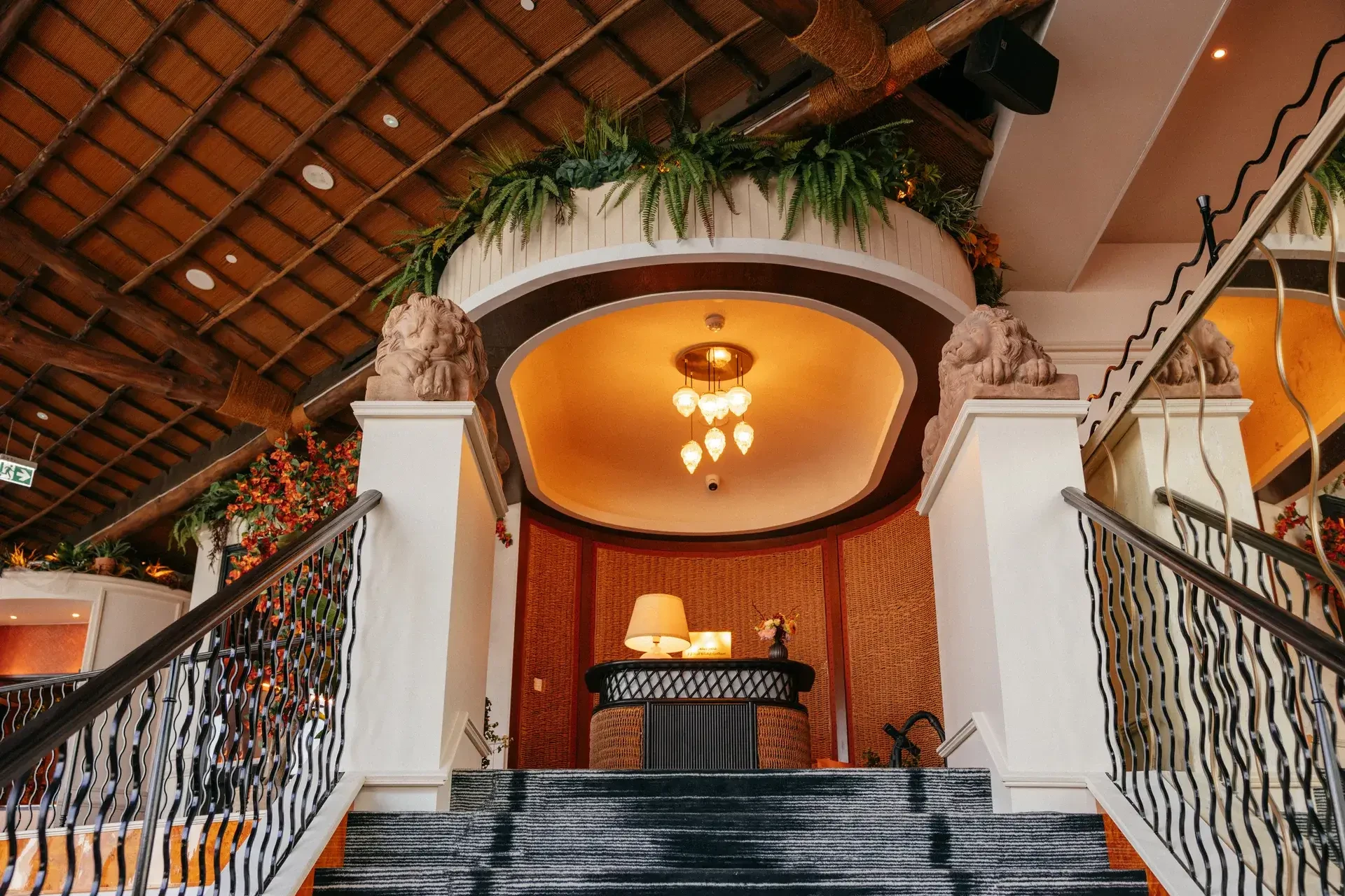 Elegant interior of Lion in the Sun Dubai with staircase and decor.
