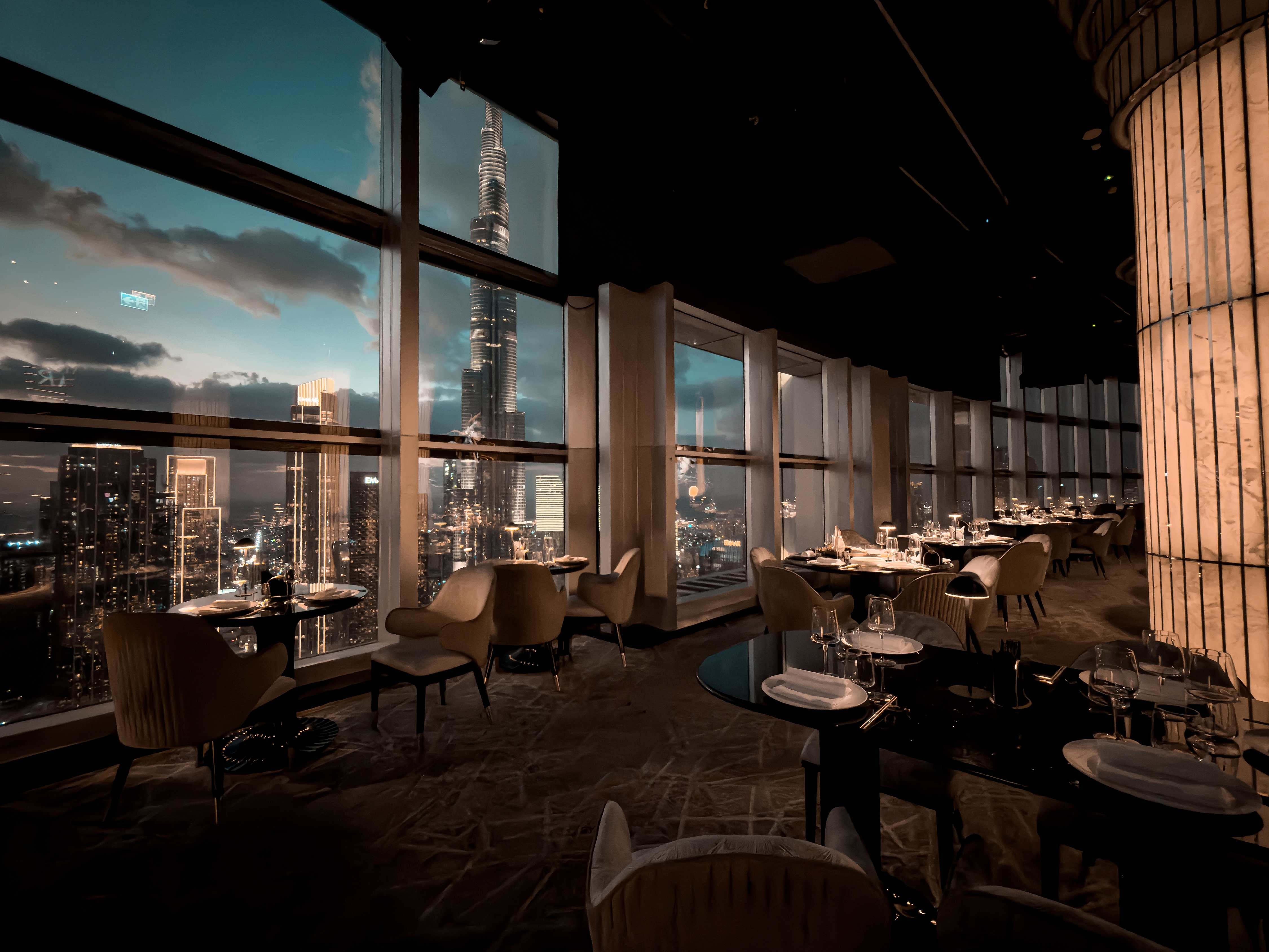 Elegant dining area with Dubai skyline view at Birds View venue.
