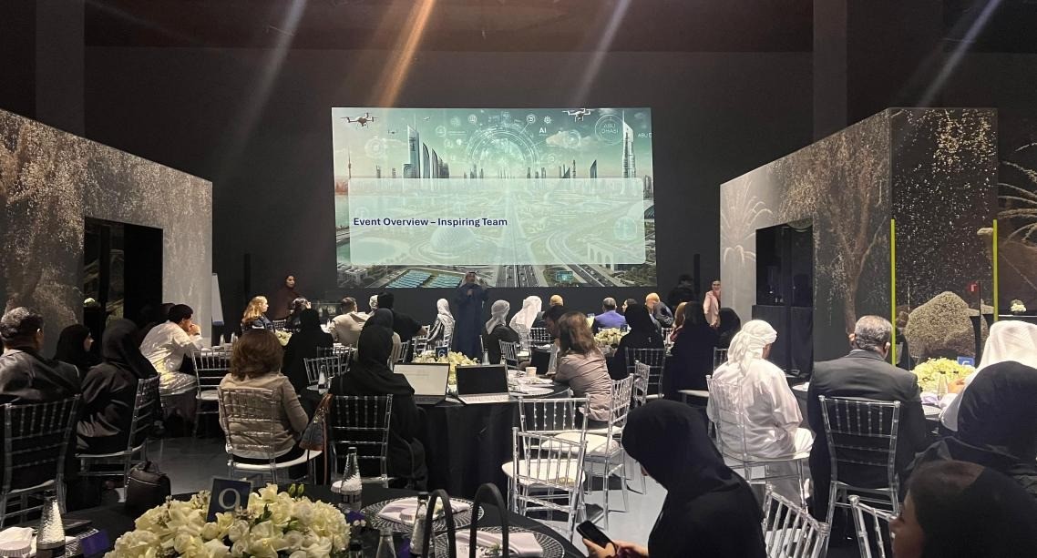 Arte Museum Dubai conference with attendees seated, large screen display.