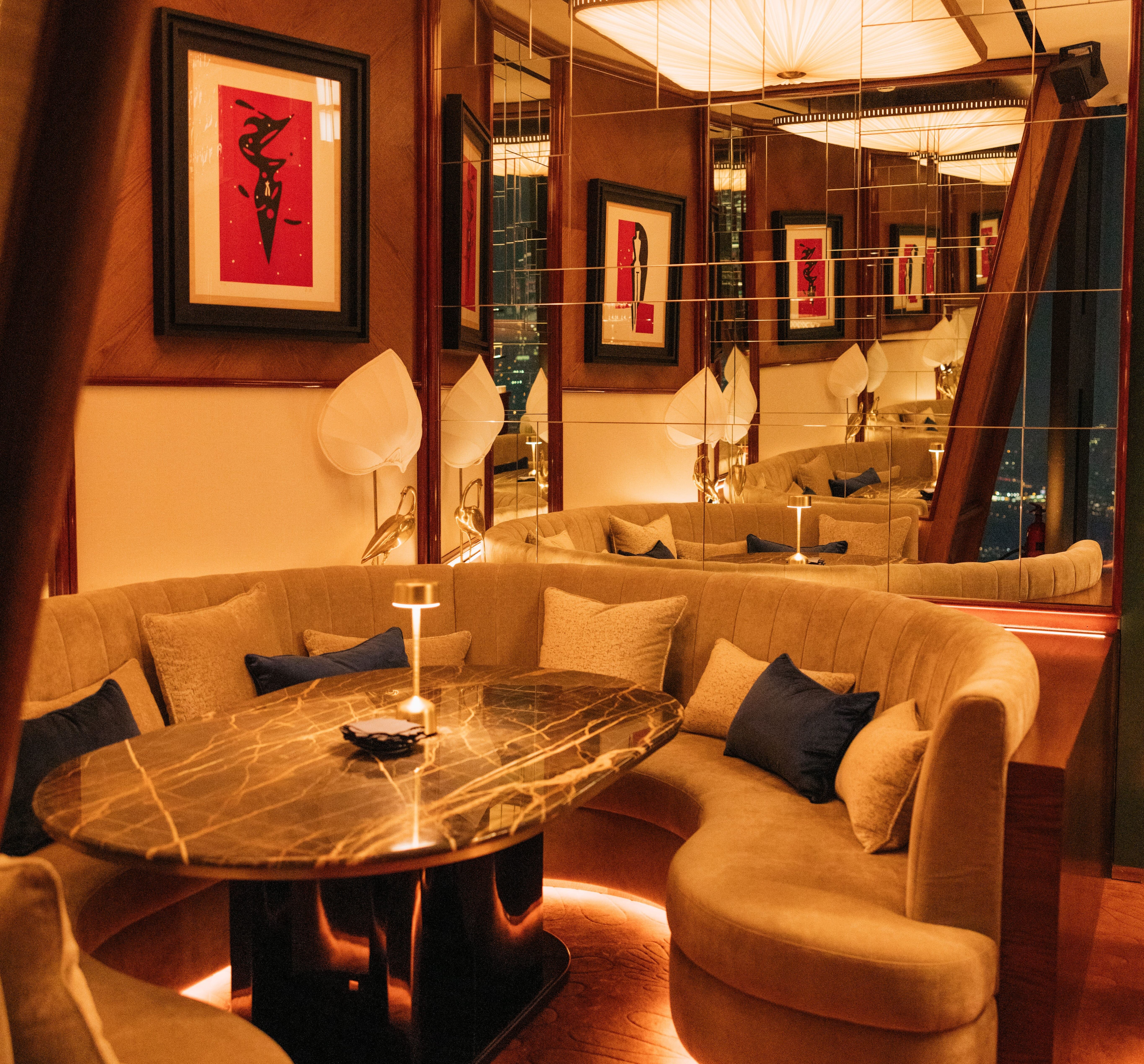 Elegant interior of Bar des Pres Dubai with plush seating.