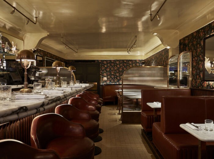 Elegant interior of Bar des Pres Dubai with luxurious seating.