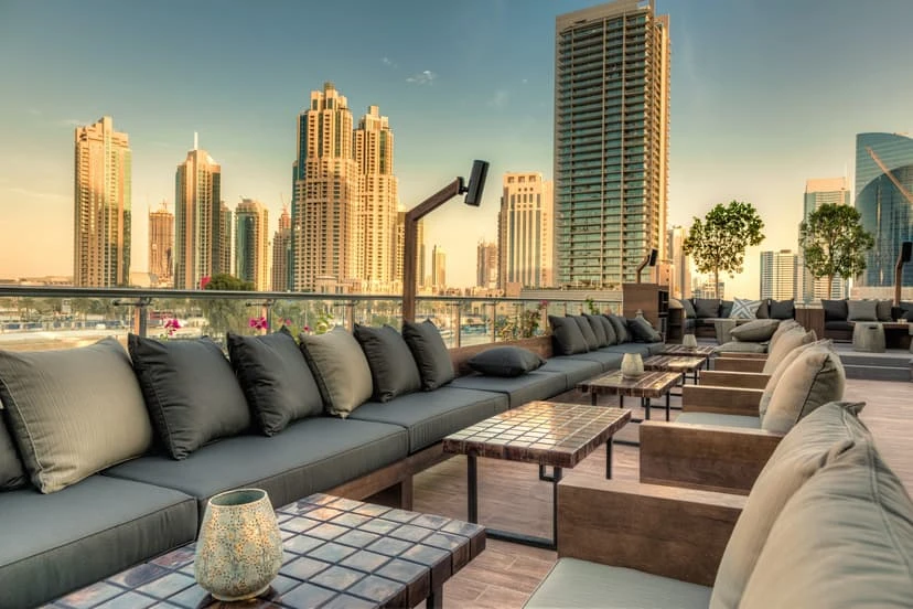 Treehouse, Taj Dubai rooftop lounge with city skyline view.