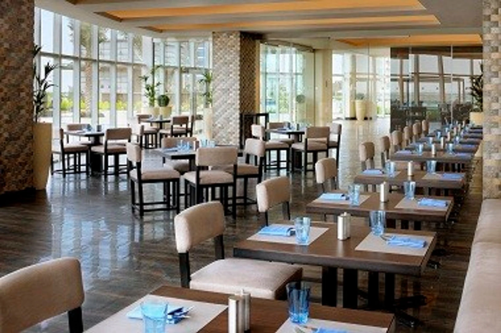 Bright dining area with large windows, JW Marriott Marquis Dubai.