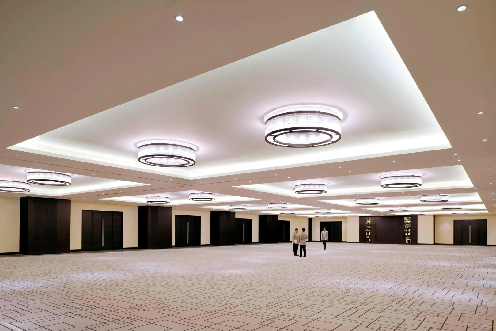 Spacious ballroom with modern chandeliers, JW Marriott Marquis Hotel Dubai.