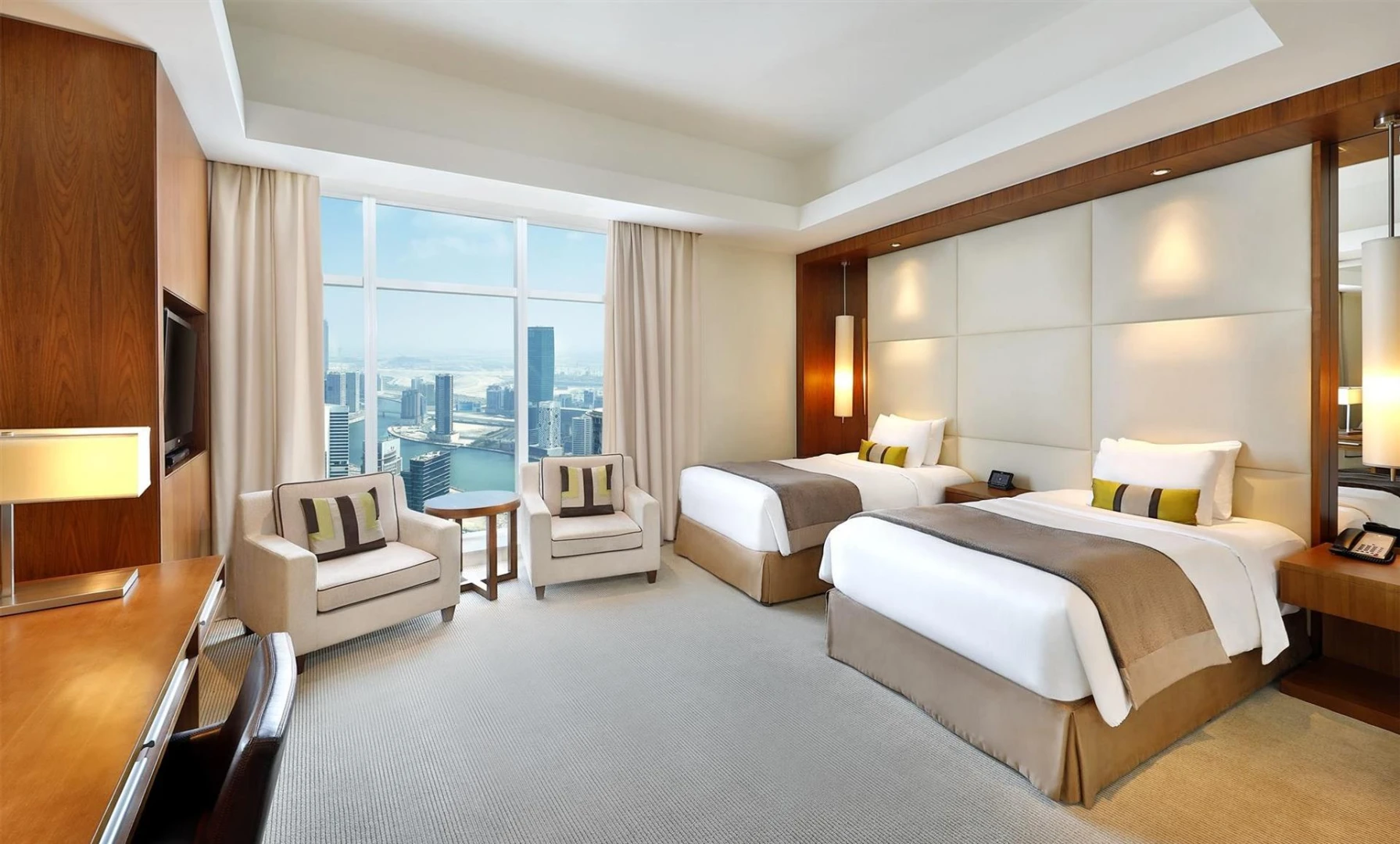 Luxury twin room at JW Marriott Marquis Hotel Dubai with city view.