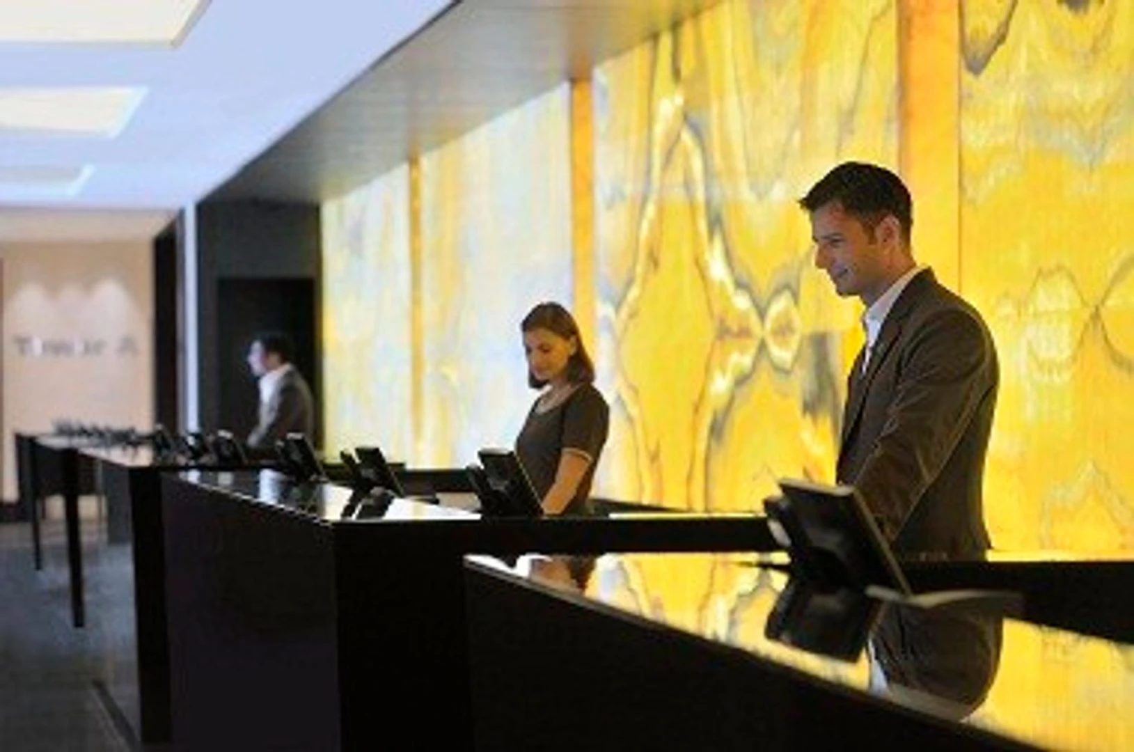 Reception area at JW Marriott Marquis Hotel Dubai with staff.