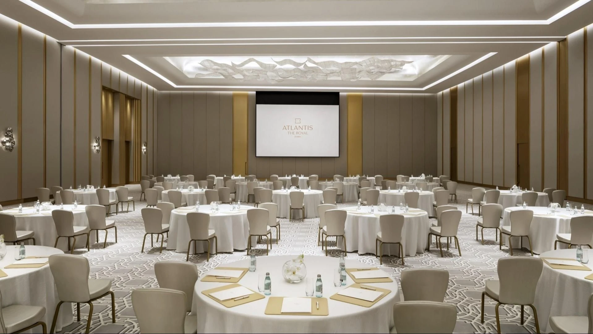 Elegant banquet hall at Atlantis The Royal, Dubai, with round tables.