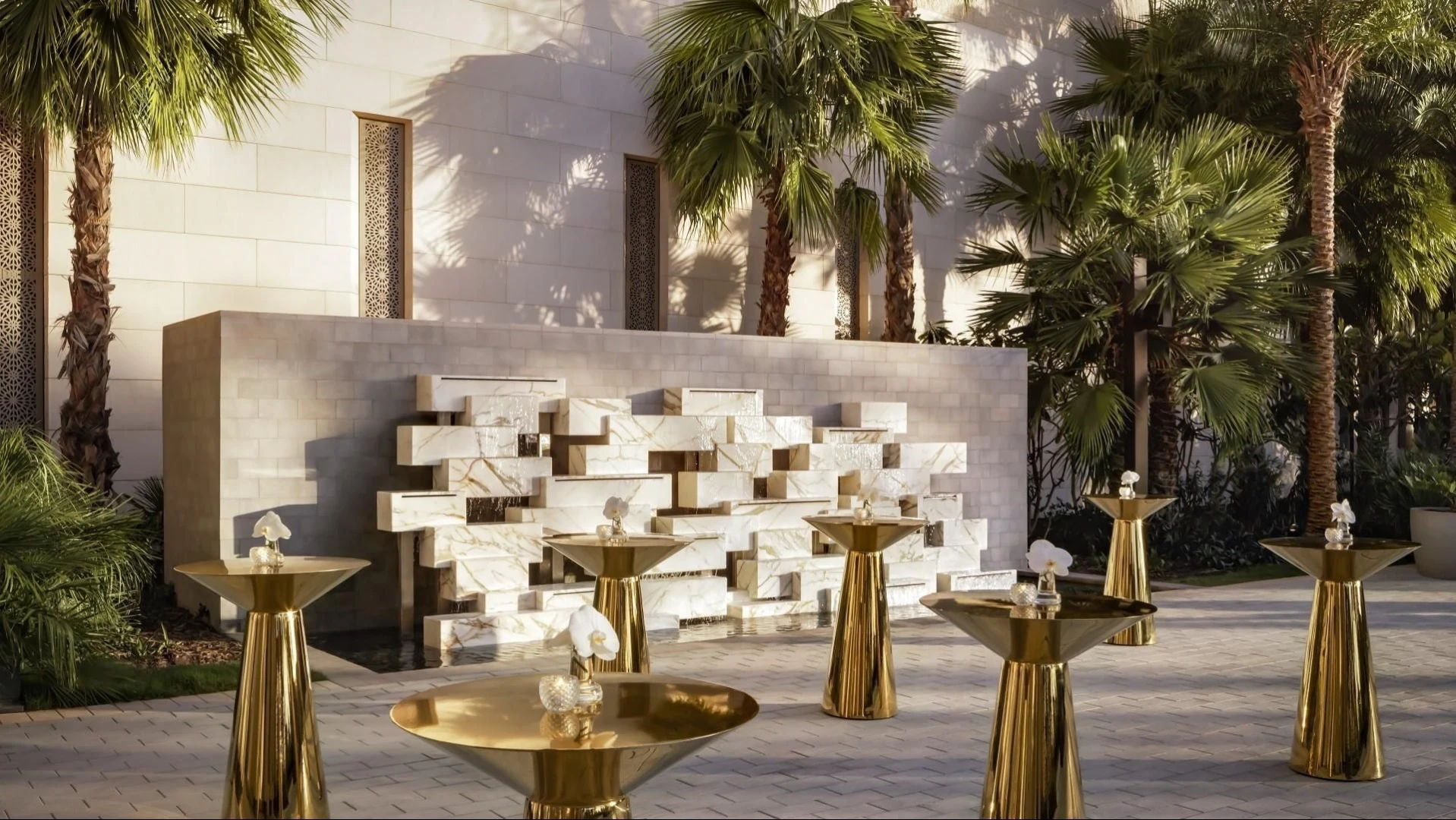 Elegant outdoor setup at Atlantis The Royal, Dubai with palm trees.