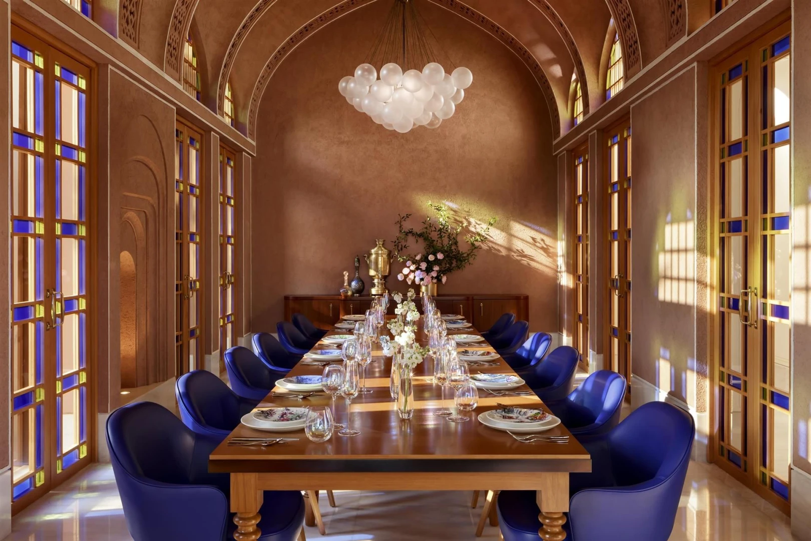 Elegant dining room at Atlantis The Royal, Dubai with blue chairs.