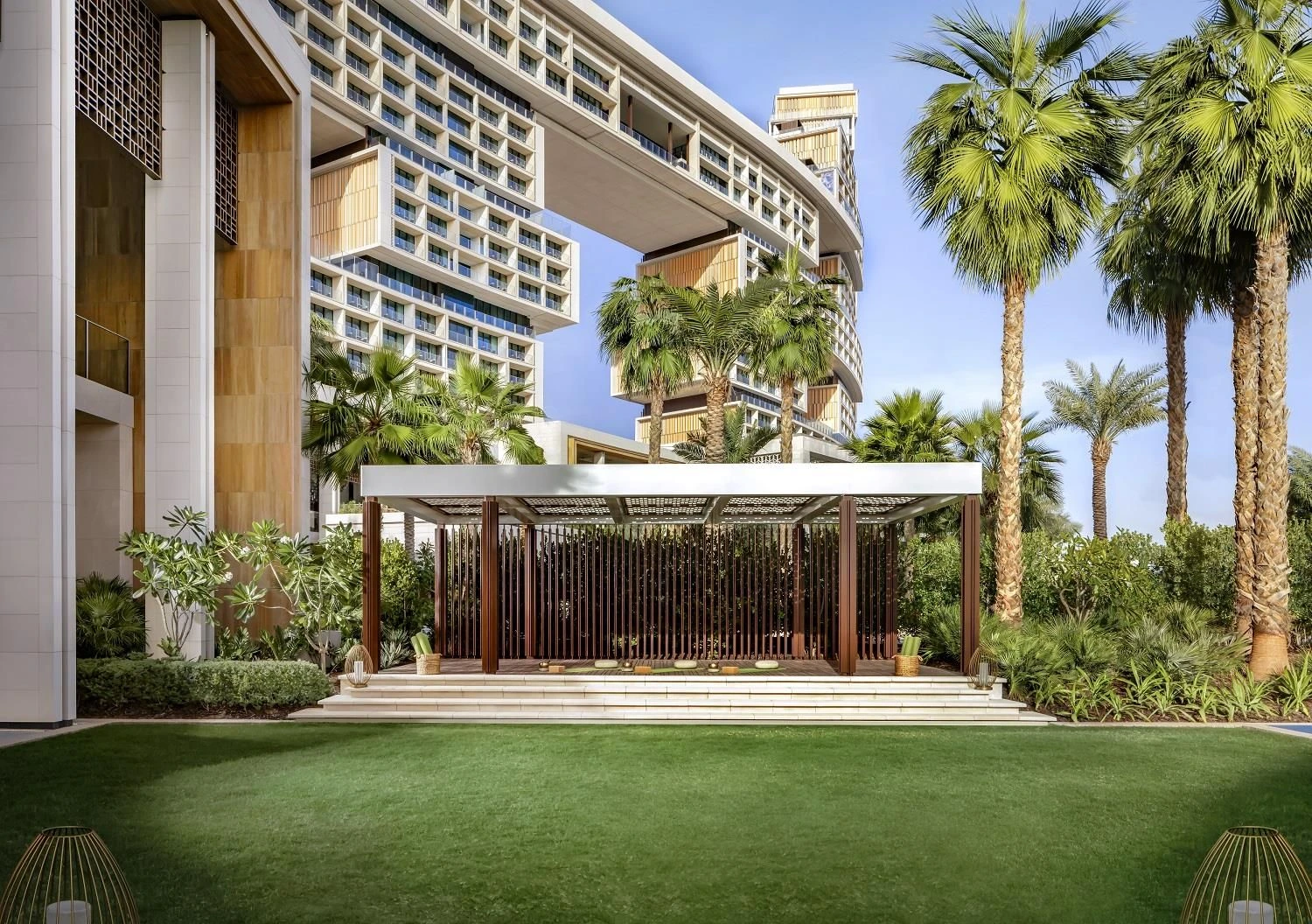 Atlantis The Royal Dubai garden with modern architecture and palm trees.