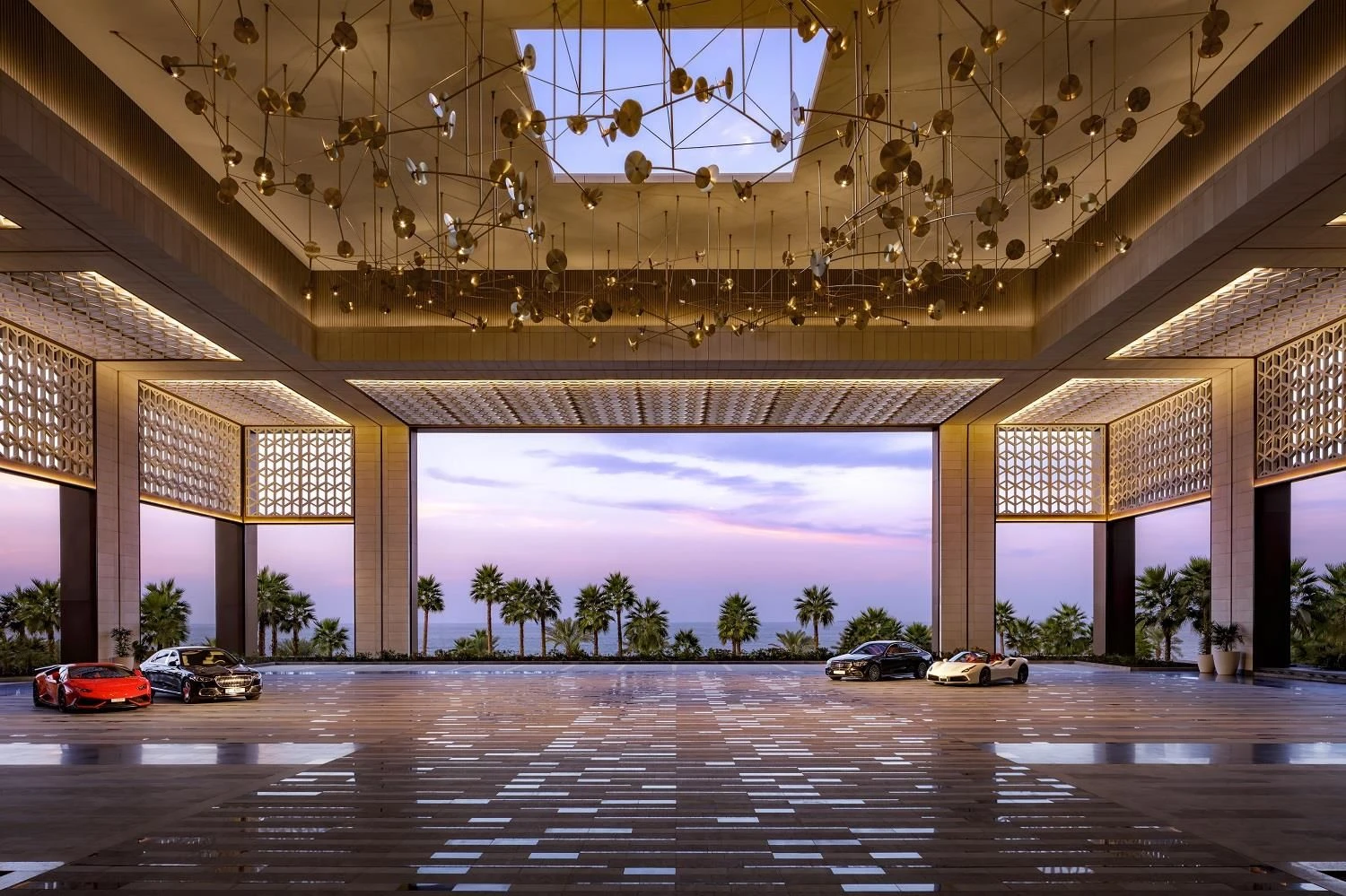 Luxurious entrance at Atlantis The Royal, Dubai, with sunset view.