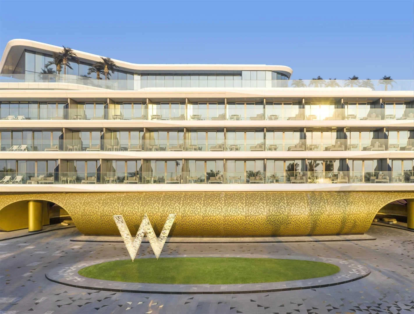 W Dubai - The Palm, modern facade with large 'W' sculpture.