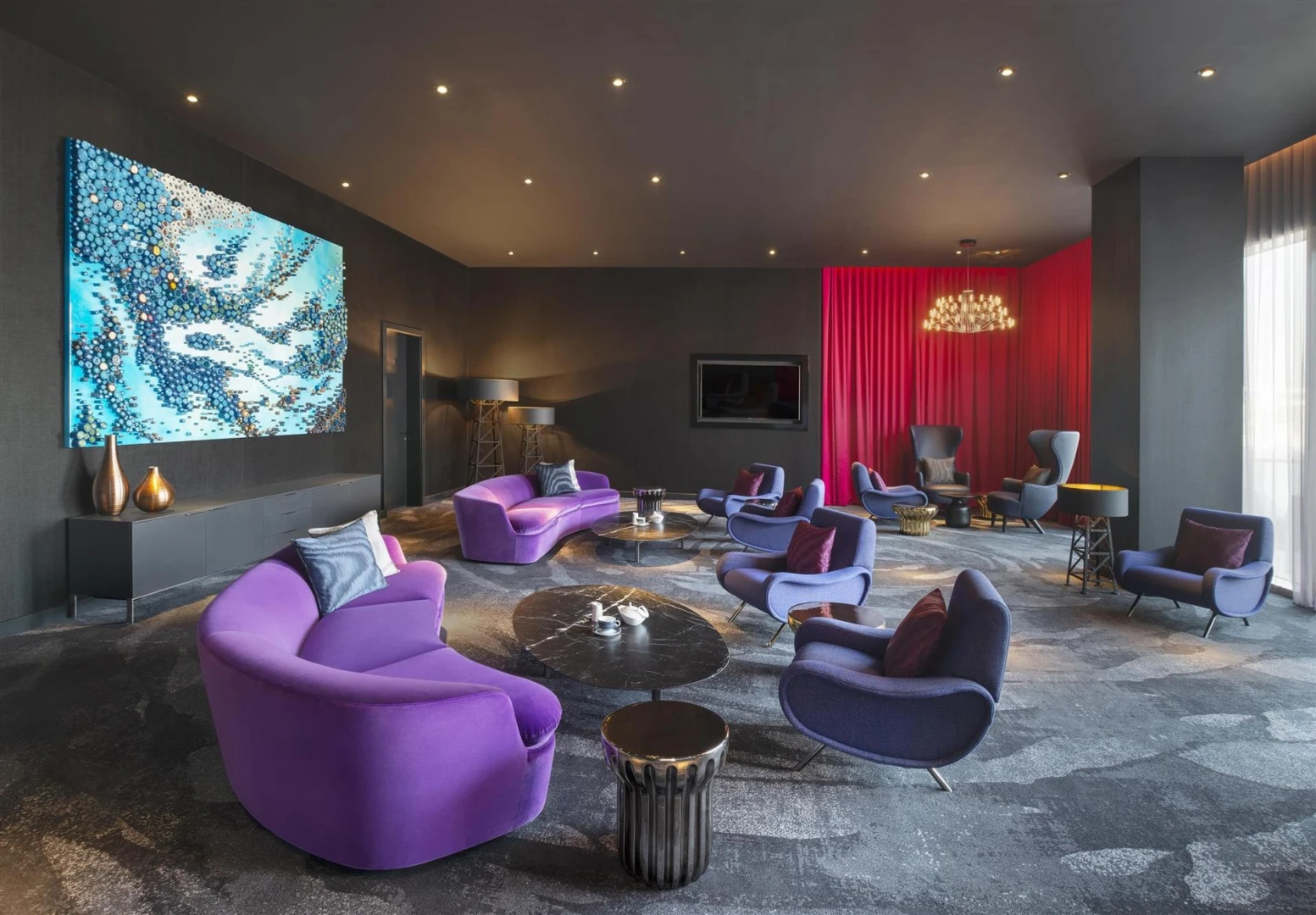 Modern lounge with purple seating at W Dubai - The Palm.