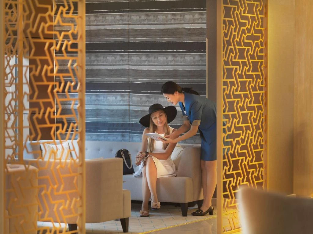 Elegant lounge at Two Seasons Hotel, Dubai with guests interacting.