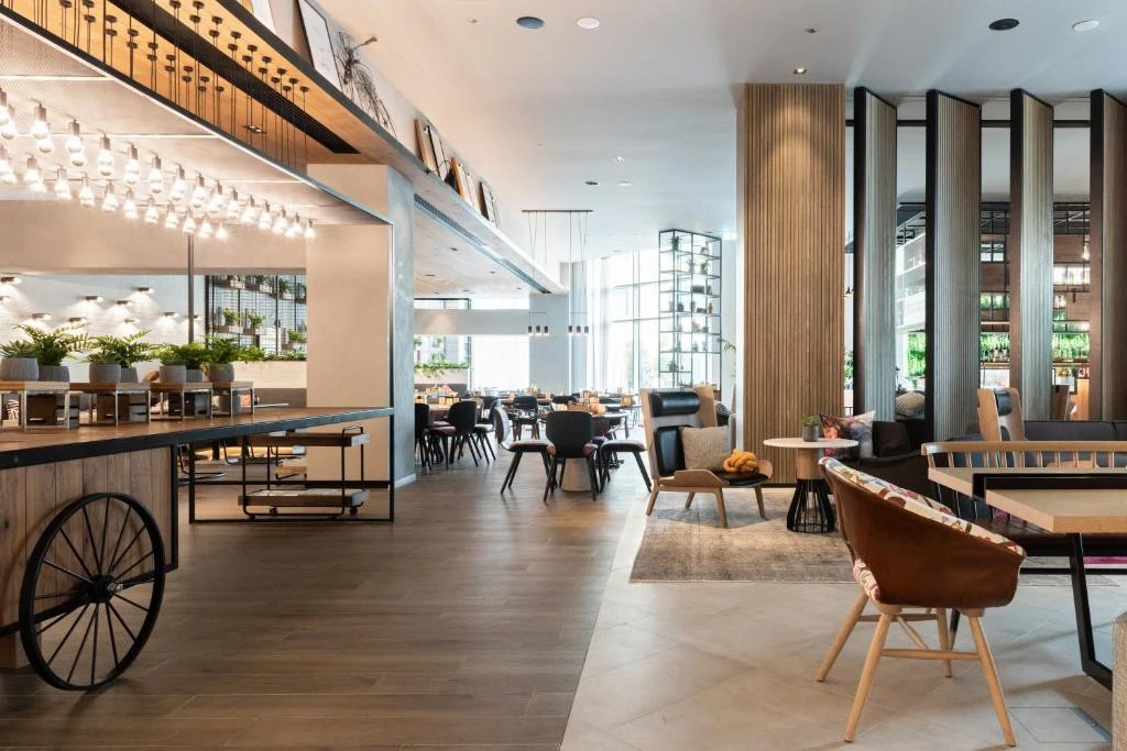 Modern interior of Zabeel House The Greens, Dubai, with seating areas.