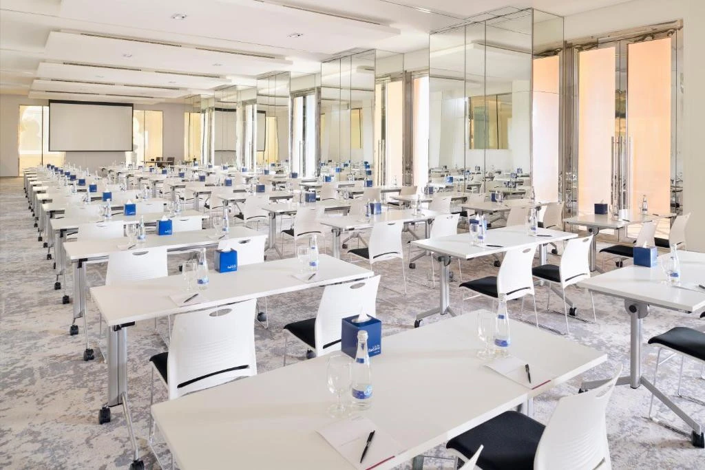 Conference room with rows of tables, Arjaan by Rotana, Dubai.