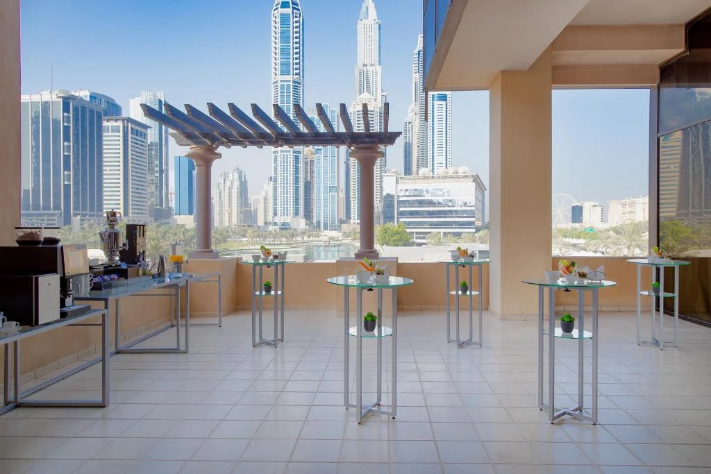Arjaan by Rotana terrace with Dubai skyline view.