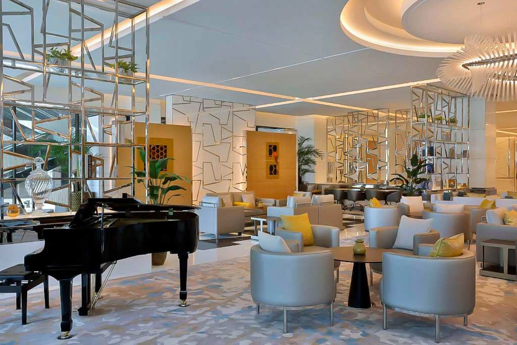 Elegant lounge with piano at Hilton Dubai Palm Jumeirah, Dubai.