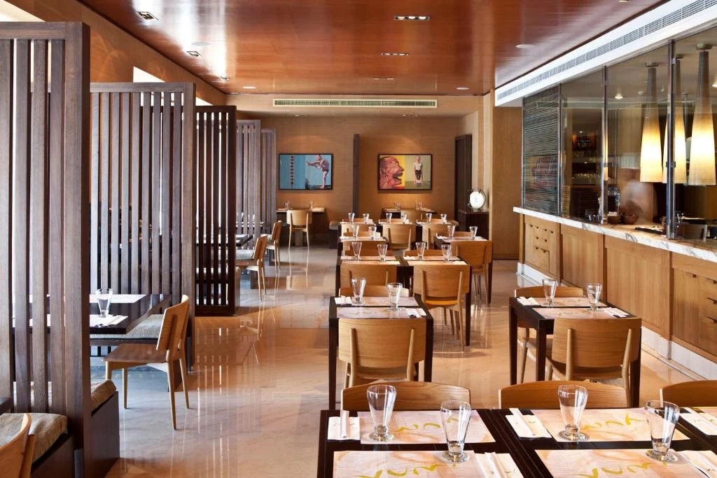 Contemporary dining space with wooden accents, Radisson Blu Hotel, Dubai.