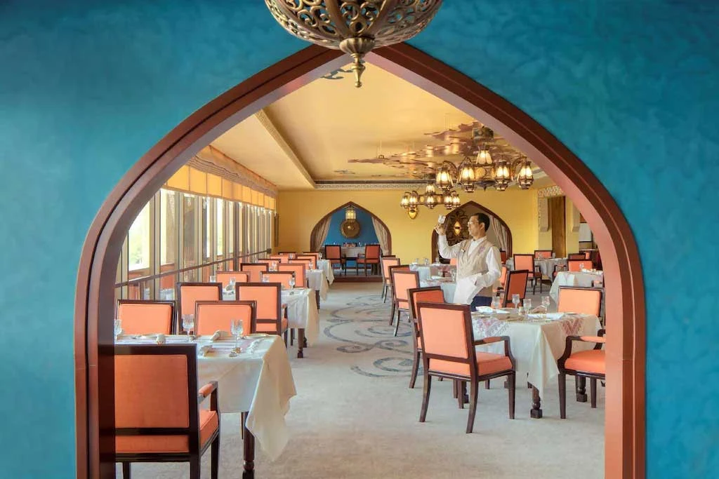 Vibrant dining room with arches, Radisson Blu Hotel, Dubai Deira Creek.