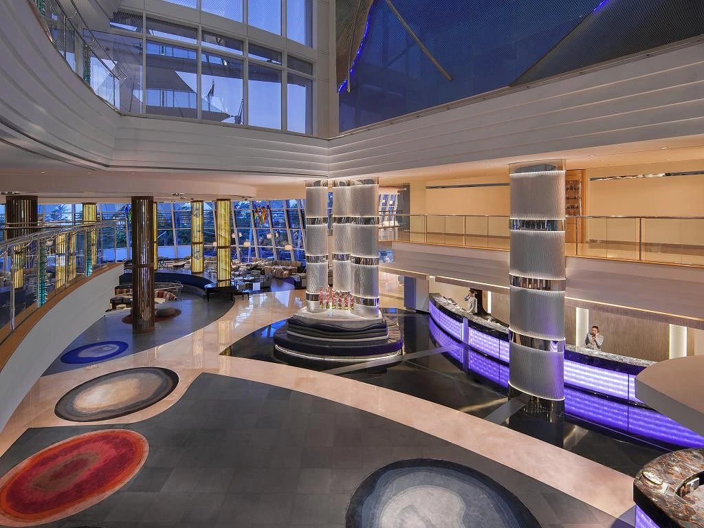 Modern lobby of Jumeirah Beach Hotel, Dubai with elegant decor.