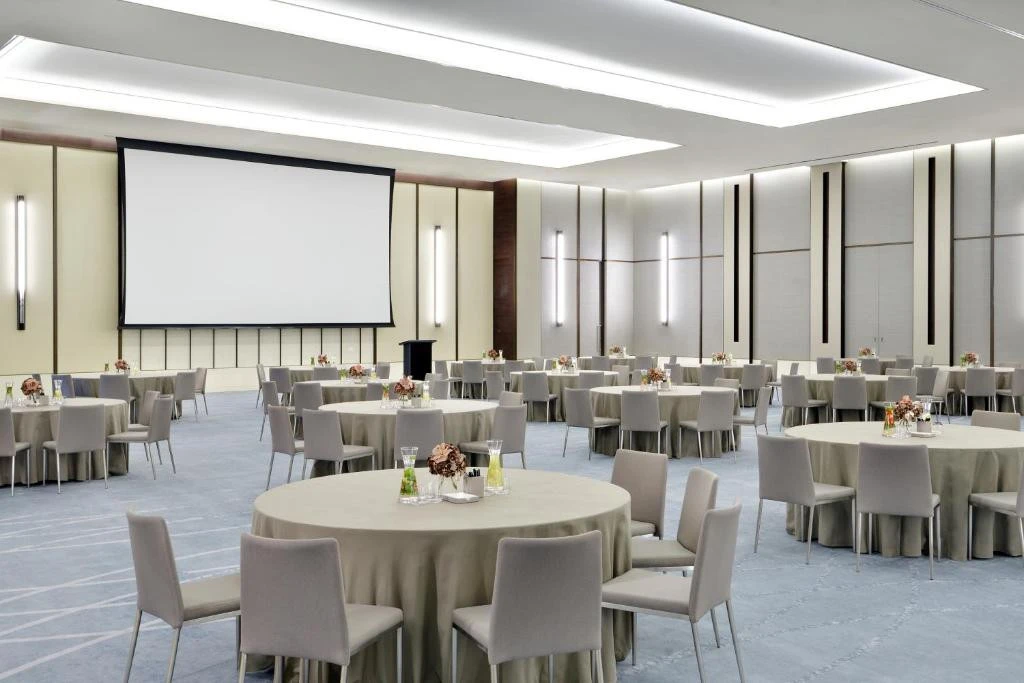 Elegant banquet hall at Address Sky View, Dubai, with round tables.