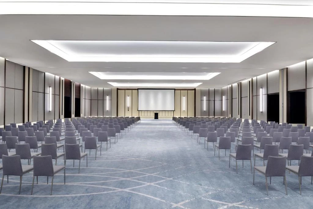 Spacious conference room at Address Sky View, Dubai, with rows of chairs.