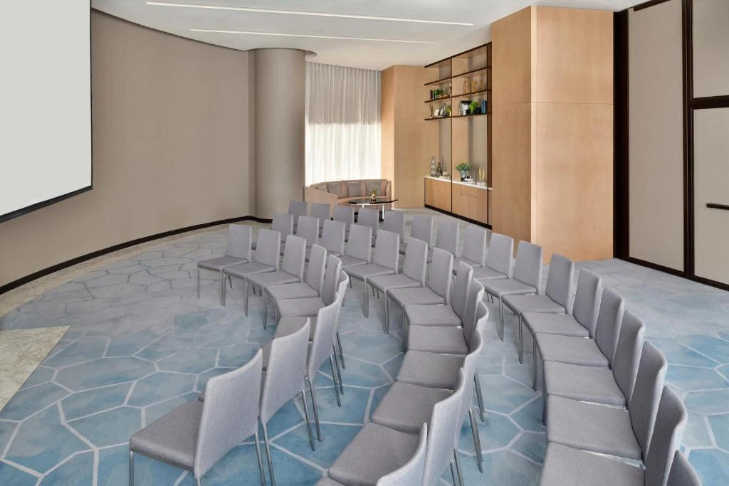 Conference room with curved seating at Address Sky View, Dubai.