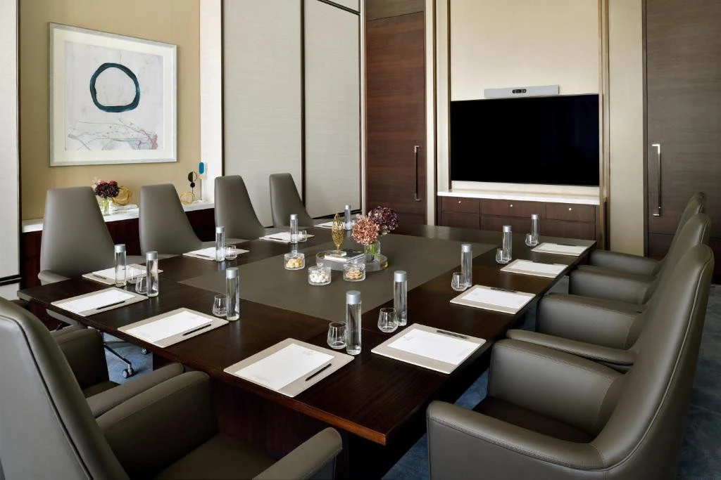 Modern meeting room at Address Sky View, Dubai with large screen.
