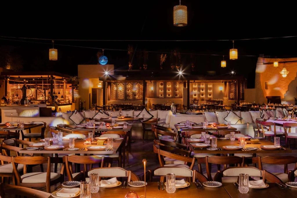 Bab Al Shams resort dining area with ambient lighting, Dubai.