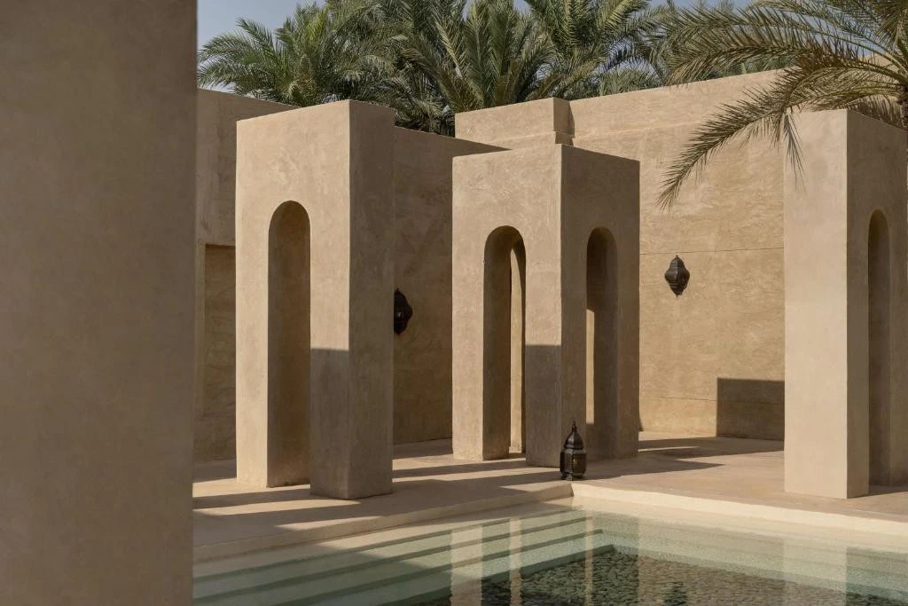 Bab Al Shams resort courtyard with arches and palm trees, Dubai.