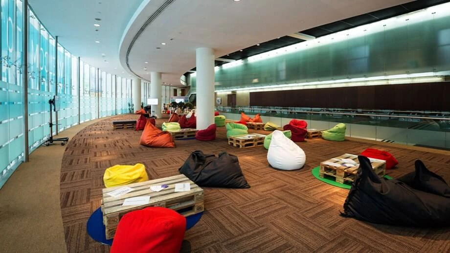 Colorful bean bags and pallets at Dubai World Trade Centre lounge.