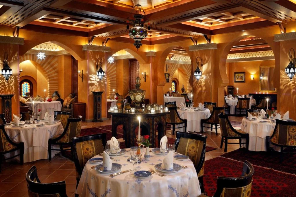Elegant dining room at One&Only Royal Mirage, Dubai, with ornate decor.