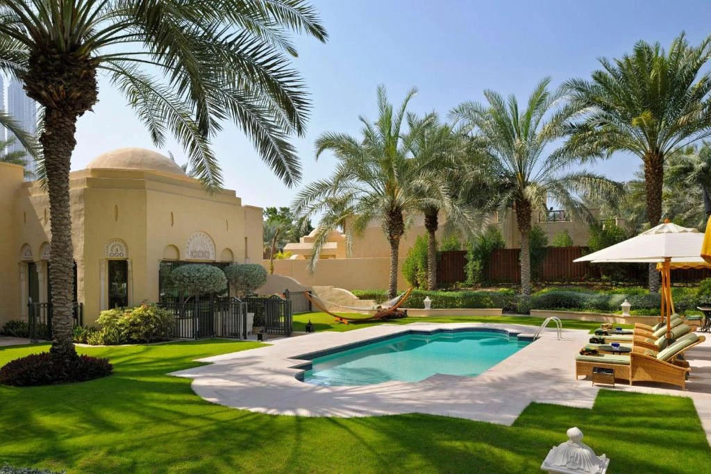 Lush garden and pool at One&Only Royal Mirage, Dubai.