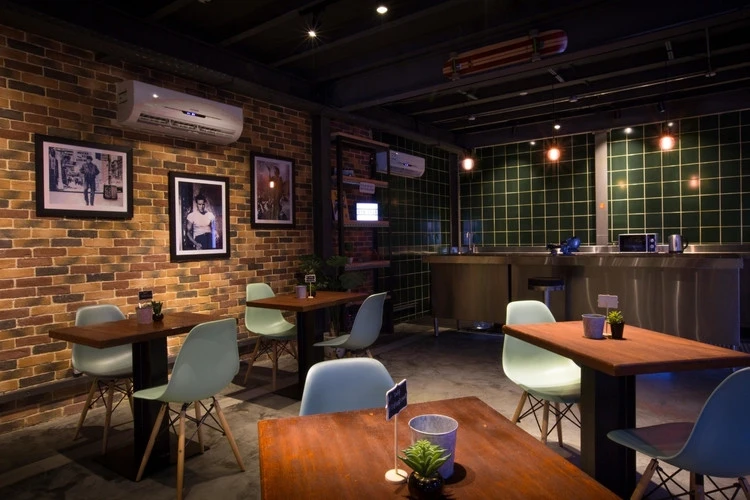 Cozy interior of Warehouse Four, Dubai with brick walls and modern decor.