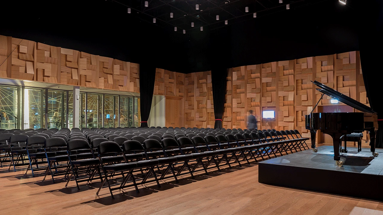 Dubai Opera auditorium with grand piano and empty seating