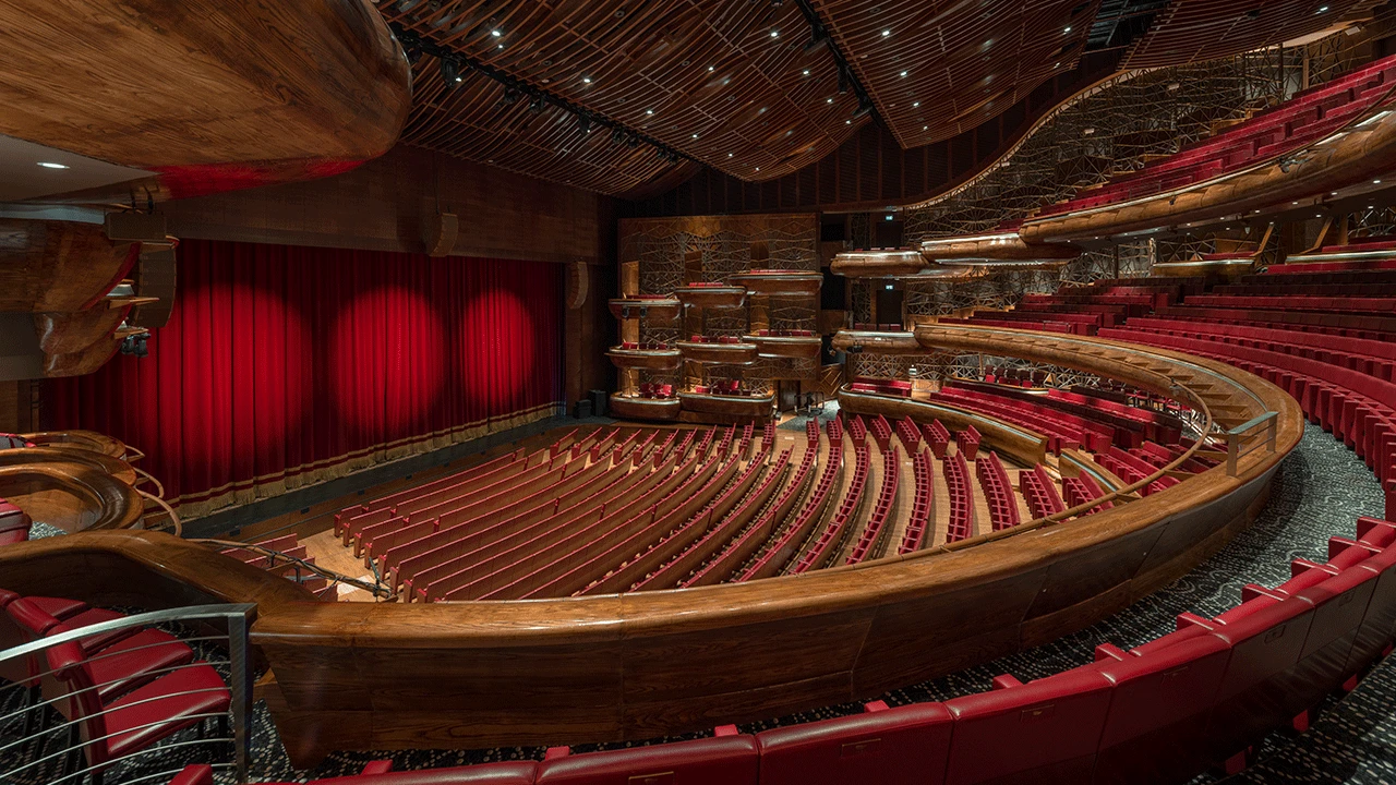 Dubai Opera's curved seating and vibrant red stage drapery.