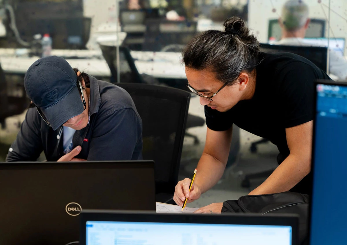 Two people collaborating at AstroLabs Coworking Space, Dubai.