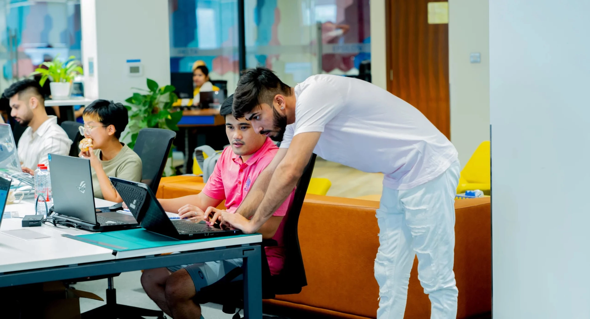 People collaborating at AstroLabs Coworking Space, Dubai.